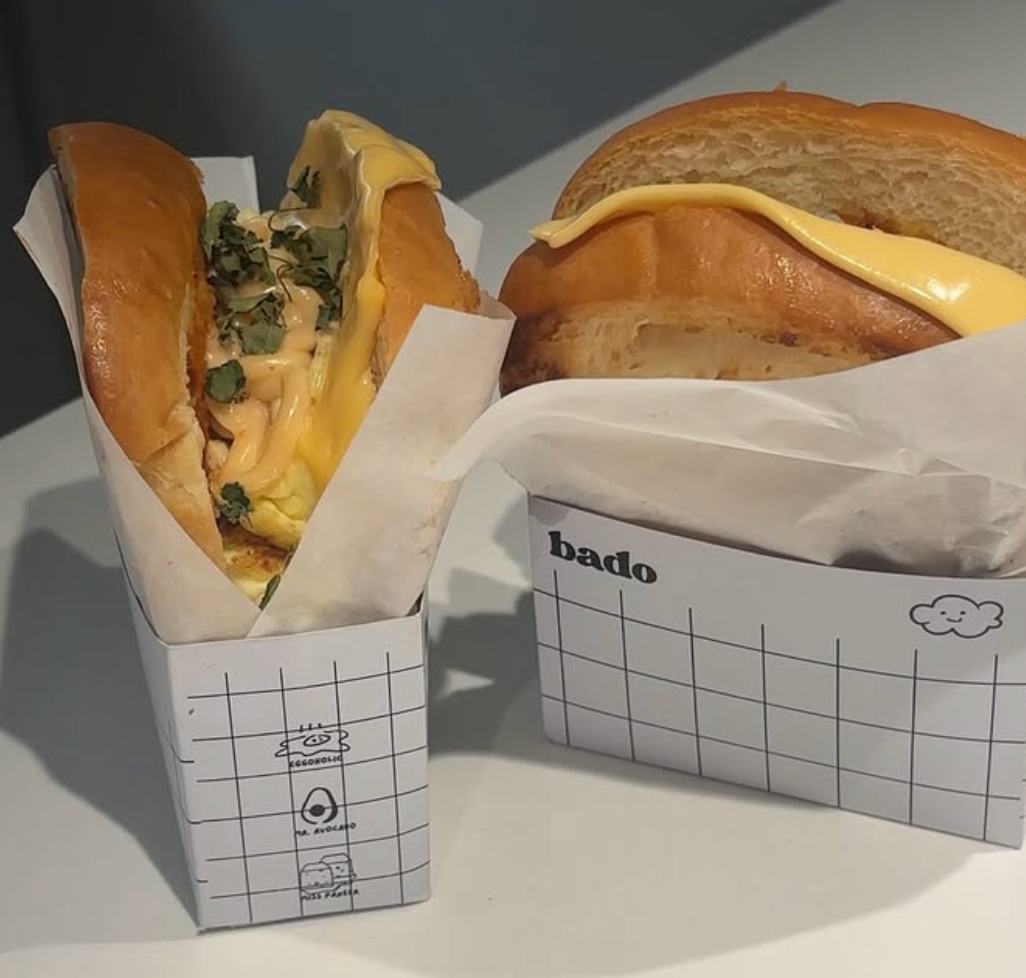Two Korean sandwiches side by side in Bado grid-print boxes